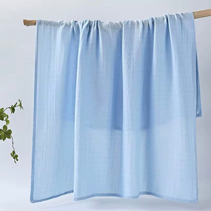 Sky blue muslin baby wrap, lightweight and soft for baby swaddling and cuddles