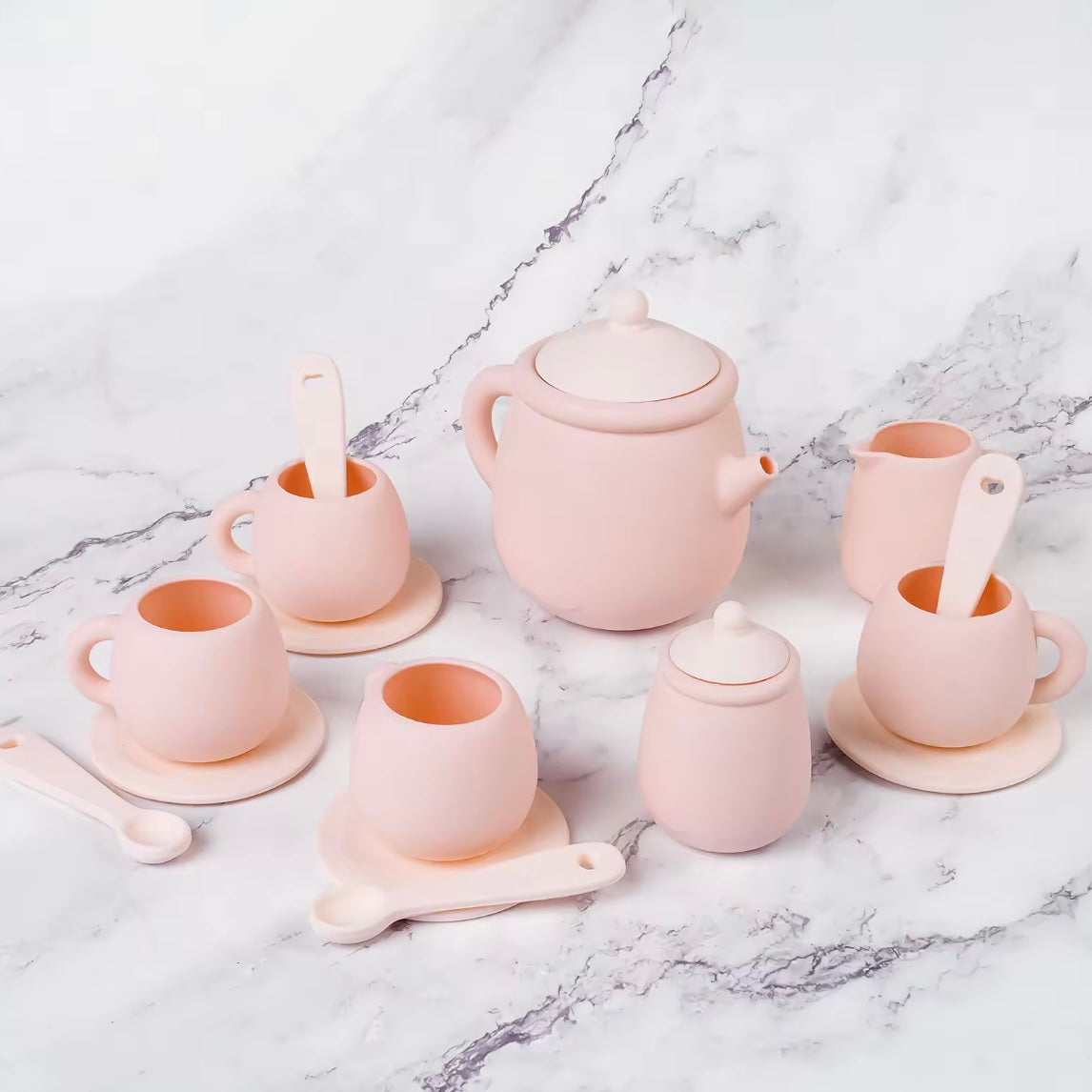 Tiny Sips silicone tea set in soft Pink featuring cups, teapot, and saucers. Durable, food-grade, and easy to clean perfect for toddler playtime.