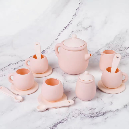 Tiny Sips silicone tea set in soft Pink featuring cups, teapot, and saucers. Durable, food-grade, and easy to clean perfect for toddler playtime.