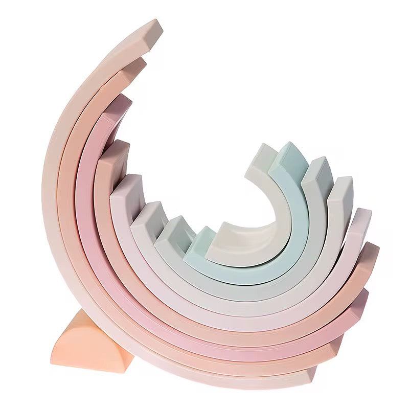 Single pastel rainbow stacked
“Pastel silicone stacking rainbow toy with 10 arches arranged in a half-circle.