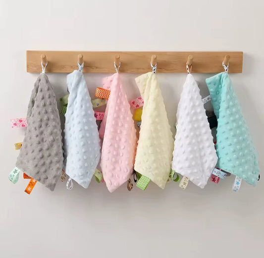 SnuggleTags Sensory Comforters for babies soft pastel comforters with textured fabric and ribbon tags, ideal for soothing, cuddles, and sensory play. Available in grey, blue, pink, yellow, white, and aqua.”