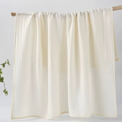  Classic white muslin baby wrap, soft and versatile for swaddling and comfort.