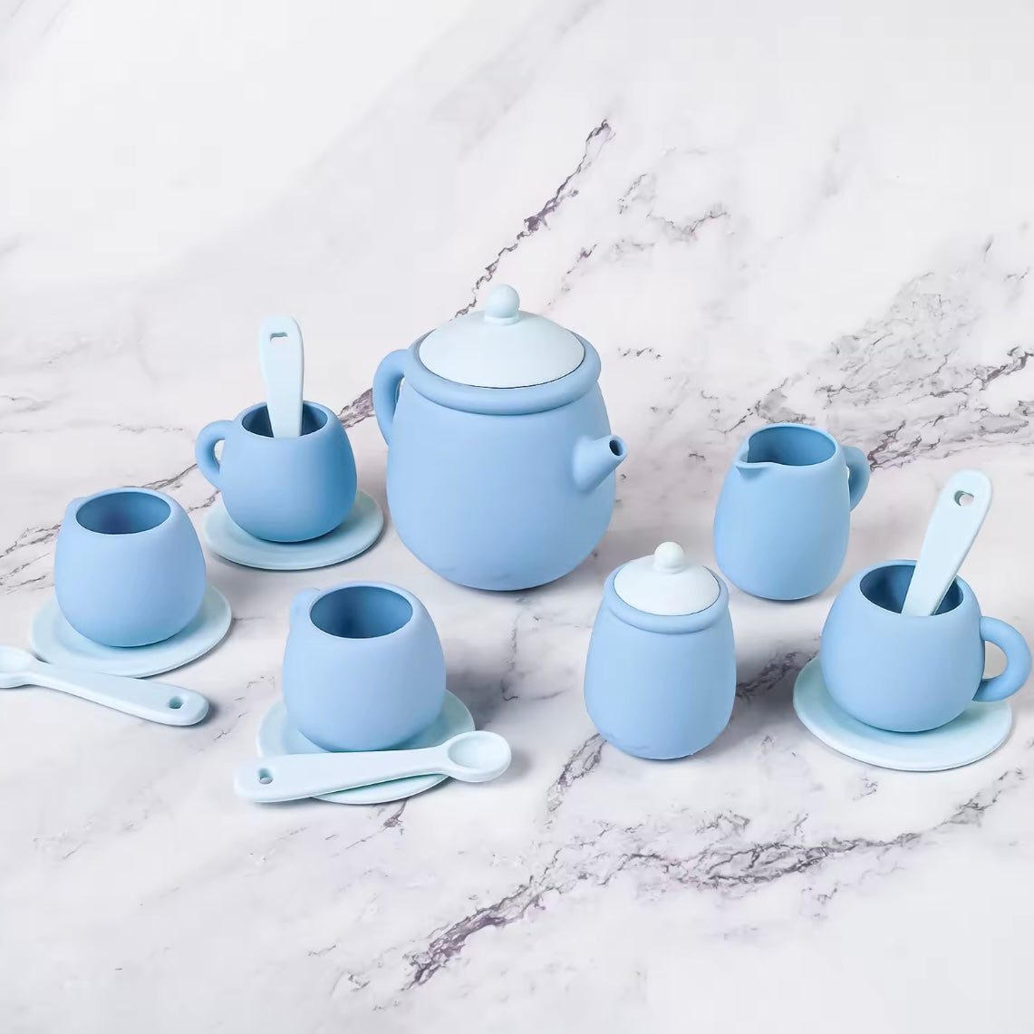 Tiny Sips silicone tea set in soft Blue, featuring cups, teapot, and saucers. Durable, food-grade, and easy to clean perfect for toddler playtime.
