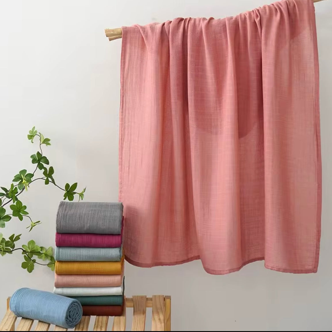 Rose pink muslin baby wrap, breathable and gentle for newborn swaddling.