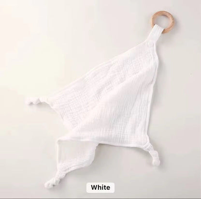 Classic white muslin comforter with natural wooden teether ring, soft and baby-friendly.