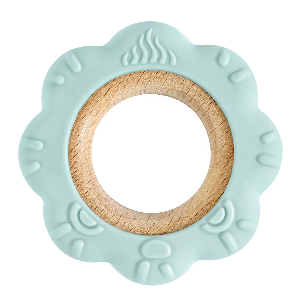 Mint green lion silicone teether with natural wood center ring.