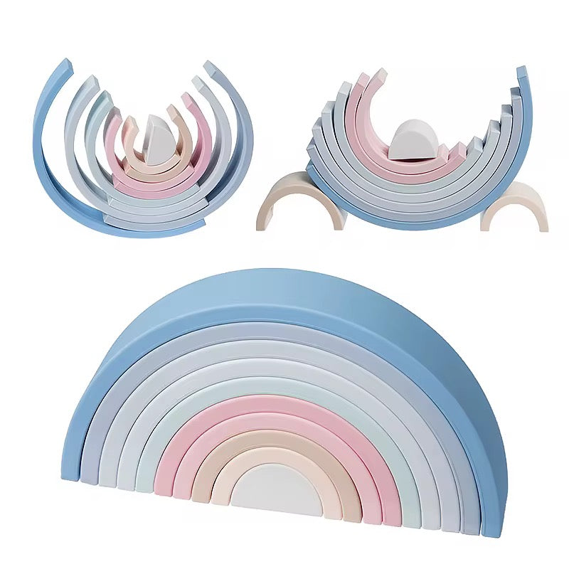Two pastel rainbows, one in blue tones
“Silicone stacking rainbow sets in pastel and blue tones, showing arches stacked in different ways.