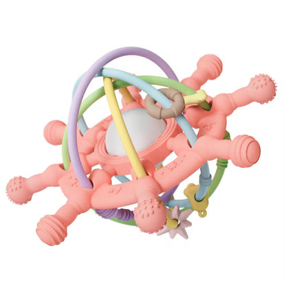 Coral pink silicone teething toy with pastel-colored loops and center rattle ball.