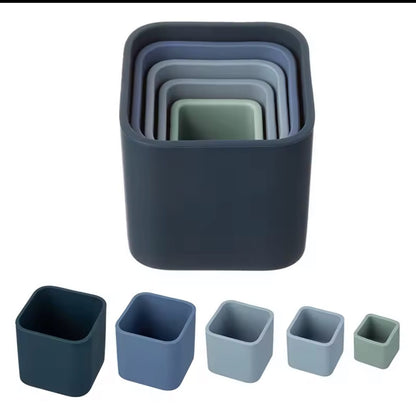Blue tone set
“Set of 5 silicone stacking cups in blue and green tones nested together and shown separately.