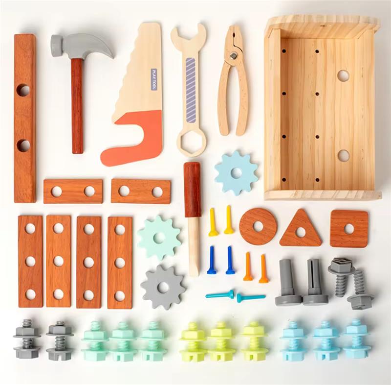 Flat lay of all pieces from the Tinker Trunk wooden tool set including tools, screws, gears, and toolbox.