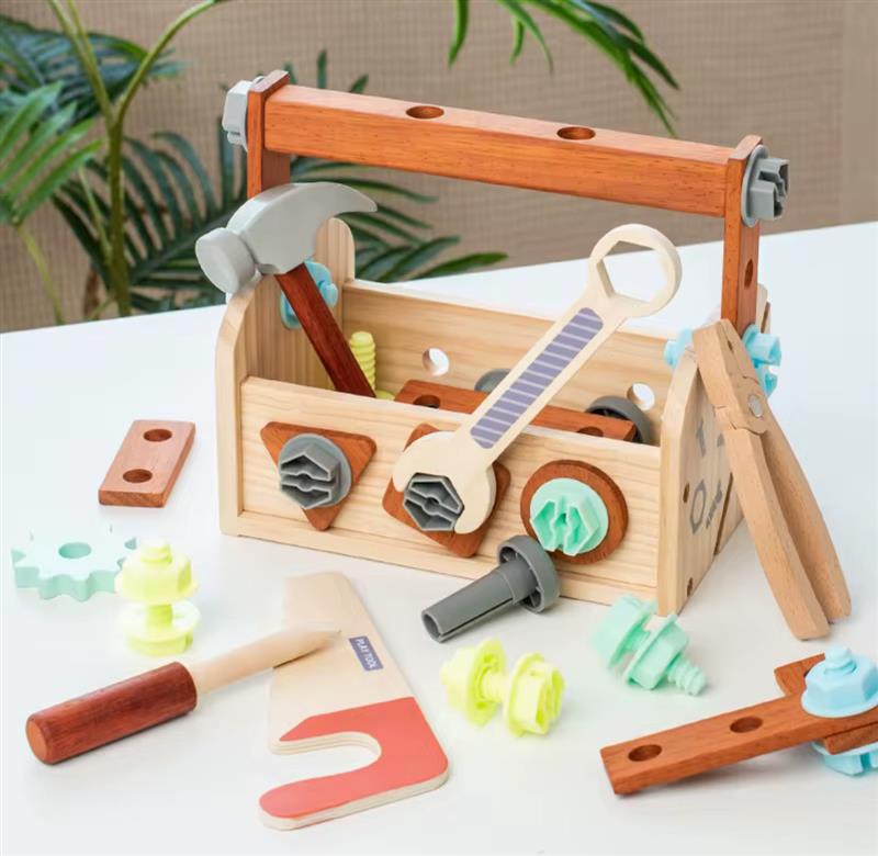 Tinker Trunk wooden tool set featuring a toolbox with toy hammer, wrench, screws, gears, and accessories.