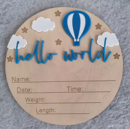 Royal blue hot air balloon hello world plaque – Wooden hello world plaque with bold blue balloon design, stars, clouds, and details section.