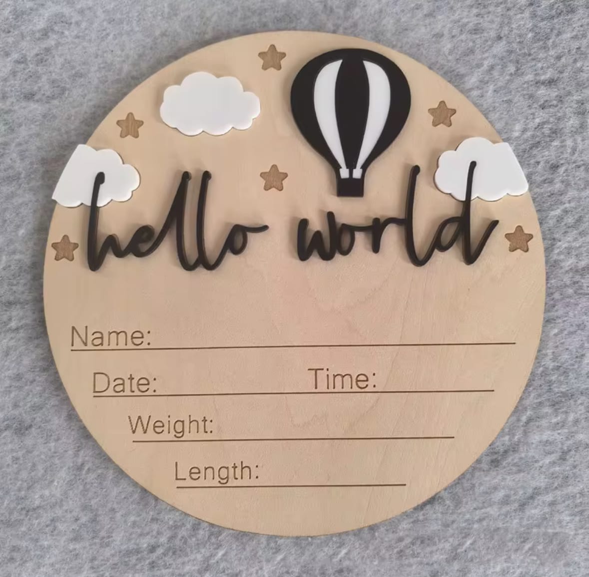 Black hot air balloon hello world plaque – Wooden newborn details plaque with monochrome black balloon, neutral stars and clouds.