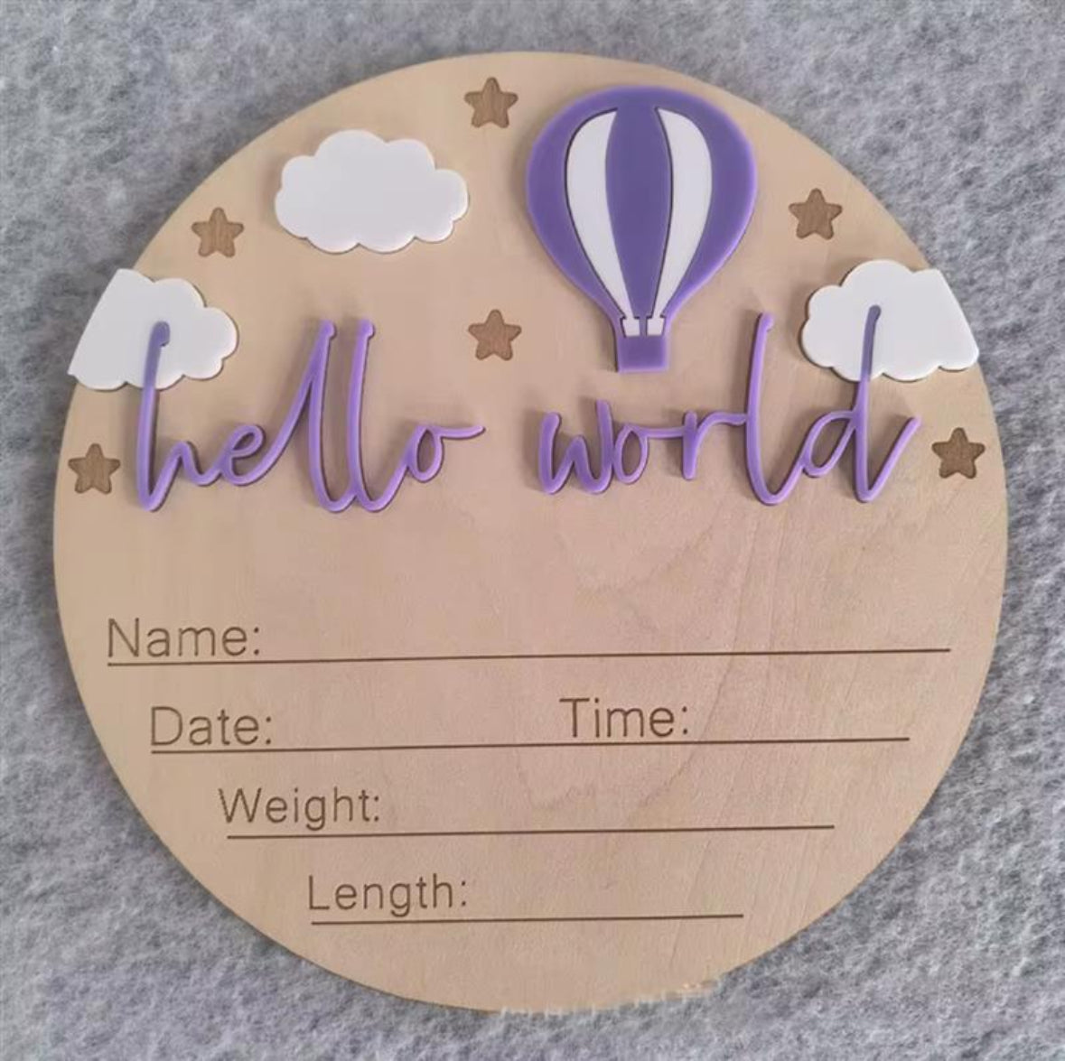 Purple hot air balloon hello world plaque – Wooden baby milestone plaque featuring purple balloon, clouds, stars, and engraved newborn details section.