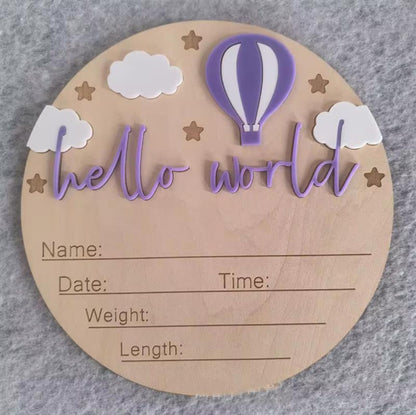 Purple hot air balloon hello world plaque – Wooden baby milestone plaque featuring purple balloon, clouds, stars, and engraved newborn details section.